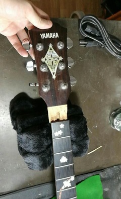 雅马哈吉他严重受损后的专业修复之路——荣御乐器维修纪实